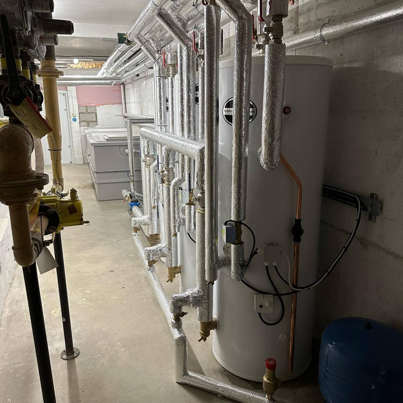 A bank of Telford Tempest Hi-Gain calorifiers with insulated primary pipework